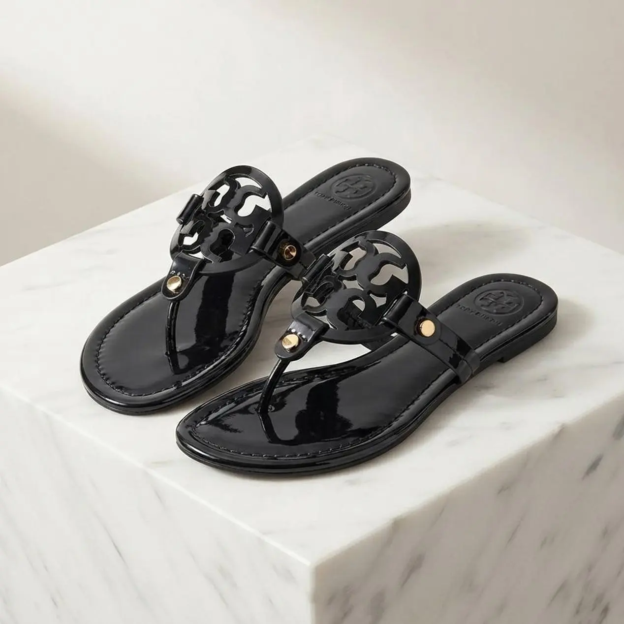 Women’s Glossy Flat Thong Footwear - Cutout Medallion T-Strap Slip-On Open Toe Casual Sandals for Summer Vacation