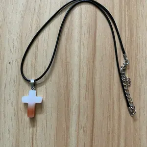 White and orange acrylic cross necklace