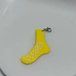 Yellow sock badge keychain