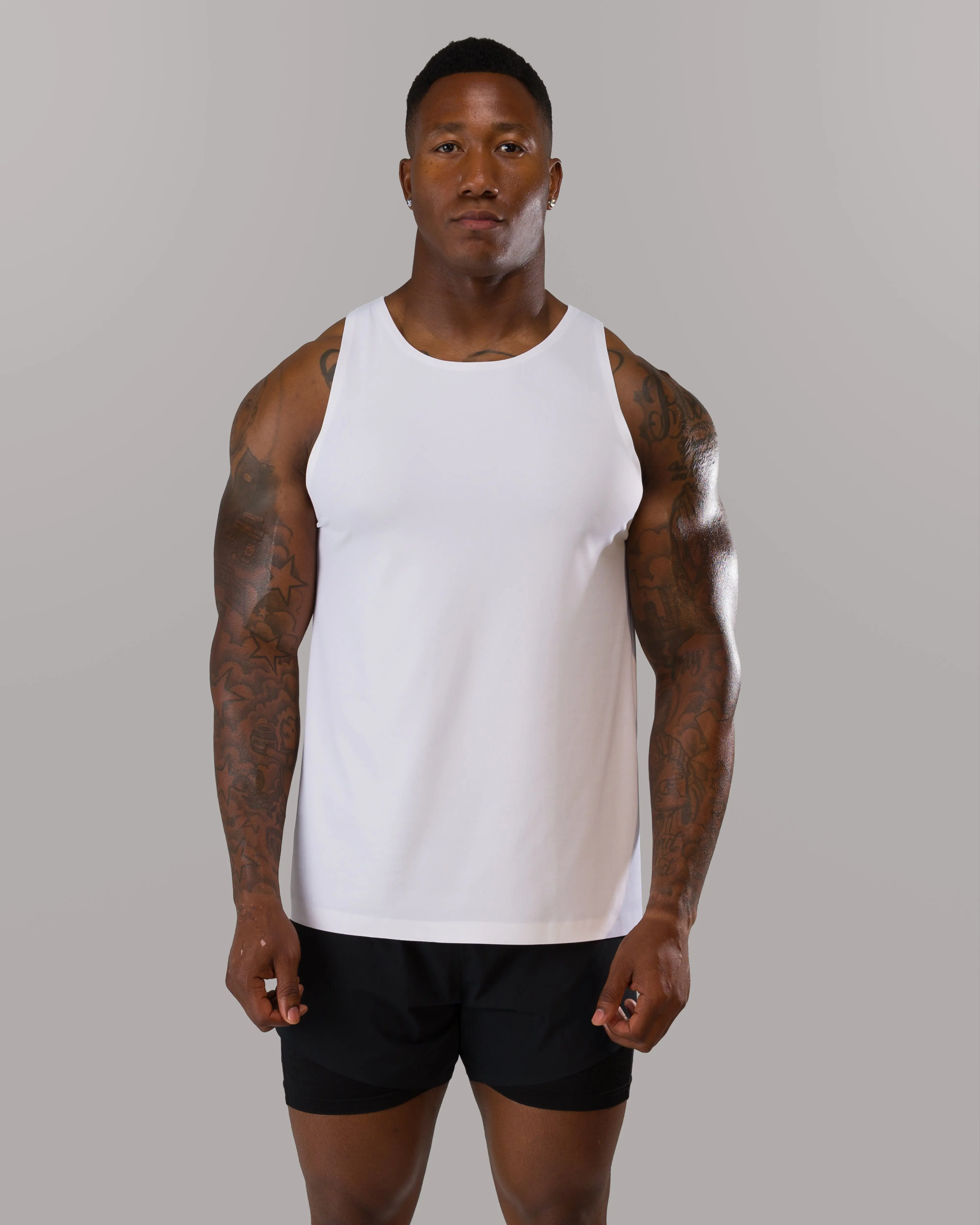Alphalete Men's AeroFlex Tank - White, Gym Stringer Tank, Breathable Mesh, 4 Way Stretch, Fitted, Lightweight, Tapered Leg, Sleeveless Workout Shirt
