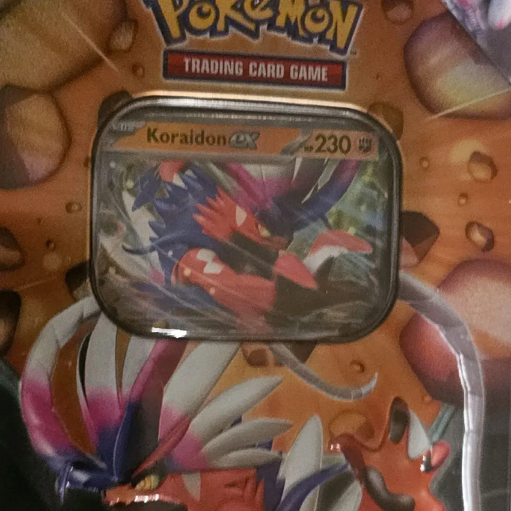 Pokmon Trading Card Game Slashing Legends Tin - Includes 5 Booster Packs & Promo Cards Featuring Koraidon ex - TikTok Shop Pokmon Trading Card Game Slashing Legends Tin - Includes 5 Booster Packs & Promo Cards Featuring Koraidon ex - TikTok Shop