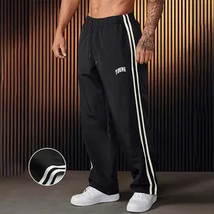 Men’s long pants with letter and stripe prints, regular fit, casual, comfortable, breathable; suitable for outdoor everyday wear; all-season men’s long pants; menswear.
