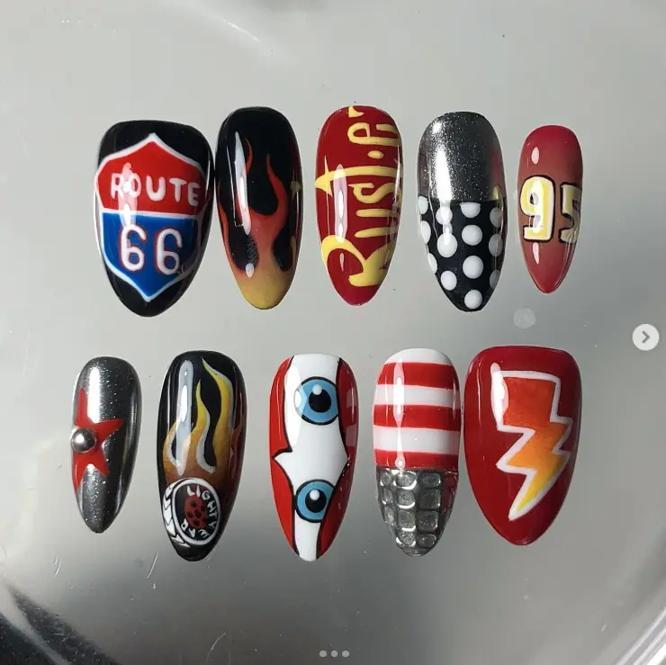 "Vibrant and Bold: Route 66, Flames, and Lightning-Inspired Nail Art with Racing and Pop Culture Elements