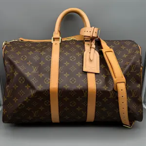 Pre-owned Louis Vuitton Coated Canvas Travel Bags Keepall 45 Bandouliere Monogram Canvas Travel Bag with Luggage Tag & Poignet Classic Design for Everyday Use