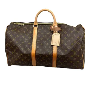 Pre-owned Canvas travel bags Monogram Keepall 50 with luggage tag