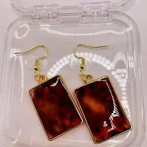 Orange cat eye tortoiseshell earrings, 14 K gold plated