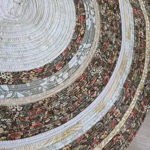 Secret Garden Medium Sized 38in Diameter Jellyroll Rug with Floral Patterns and Circular Design