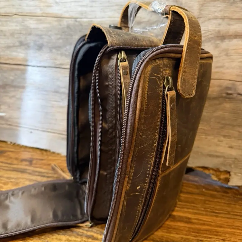 Brown leather toilet bag with zipper closure and multiple pockets #leatherbag