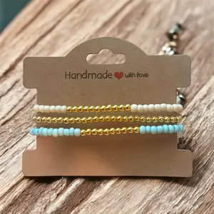 Light turquoise/cream with gold accents stackable bracelet set