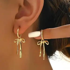 Bowknot tassel earrings, simple and elegant, niche versatile gold earrings, light luxury style