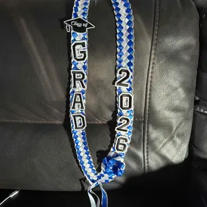 2026 Graduation Leis for Him Her - Hand-Woven Blue Braided Ribbon Lei with GRAD Letters & Cap Charm, Adjustable Graduation Money Lei with Safety Pins for Class of 2026 Graduation Ceremony Party Favors