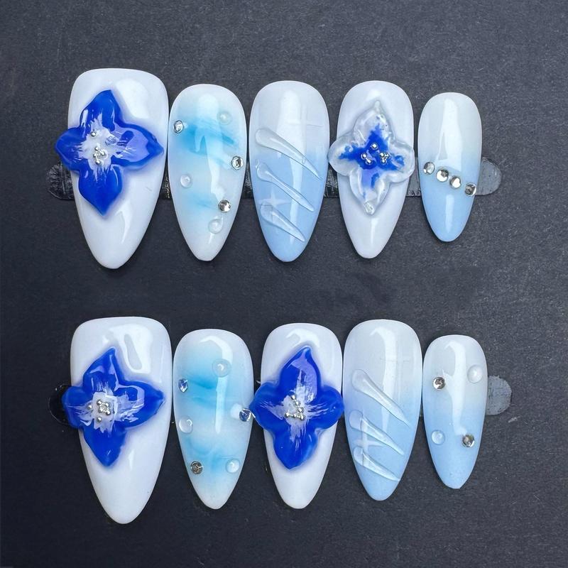 Blue Floral Press On Nails with 3D Flowers and Rhinestones – Icy White and Baby Blue Gradient Almond Nails. Artificial reusable trendy art.