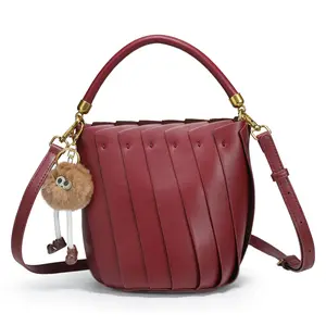 CKSO Burgundy Leather Bucket Bag - Premium Handbag with Top Handle, Adjustable Crossbody Strap, Unique Pleated Design, Cute Pom-Pom Charm, Stylish for Daily & Dating
