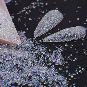 10000Pcs Pixie Nail Crystals Rhinestones-Micro Nail Beads 1.2mm Mini Glass Dust Nail Jewels-Tiny Small Gems Stones Iridescent Shine-Charms Accessories For Nail Art (Clear AB) European Glitter Diamond Fake Nails