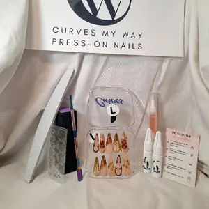 "Step into luxury with CMW’s 10-piece long stiletto press-on nail set—featuring a soft nude base adorned with intricate gold details and warm caramel accents. Each nail radiates opulence, with sculpted gold patterns and a rich, sophisticated color palette