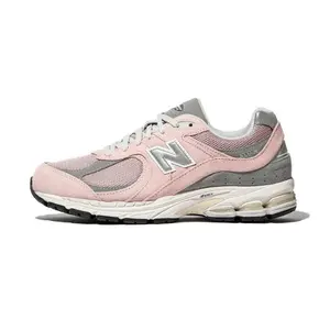 New Balance New 2002R Pink Men's Sneaker with "Orb" Design, Closed Lacing, and Comfortable Fit for Active Use