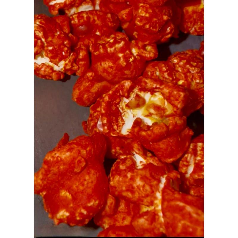 Junior Snacks Co. Hot Cheddar Popcorn; Yellow Cheddar meets our Spicy Red Seasoning