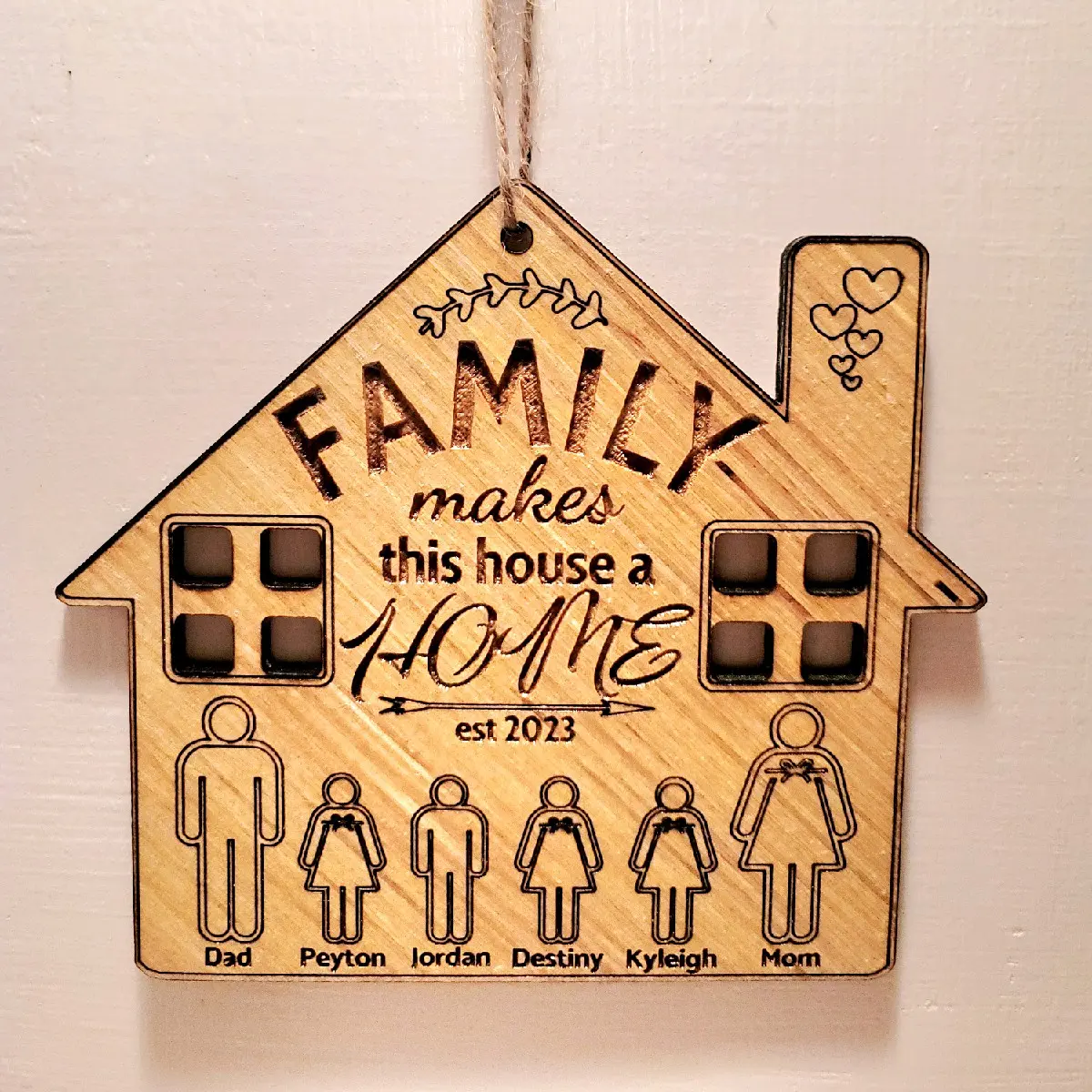 'Family Makes This House A HomeFamily Makes This House A Home' Keepsake This unique solid wood handcrafted keepsake features your own personalization and is available in 2 different sizes. Decor Hanging Ornament Hangable Wooden Decoration