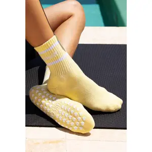 Serving Core Pilates Grip Crew Socks in Pale Yellow