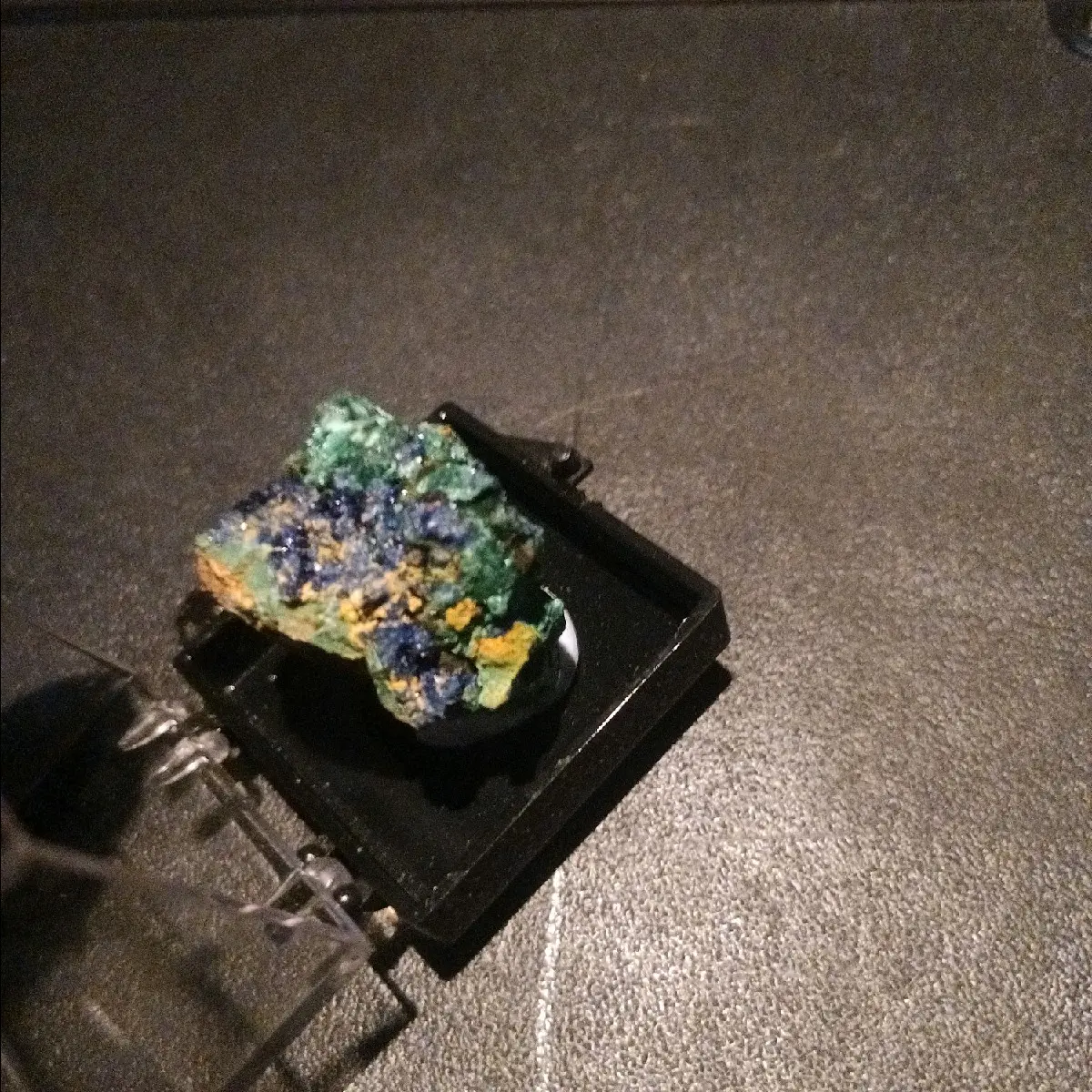 1 Azurite stone in small display case.