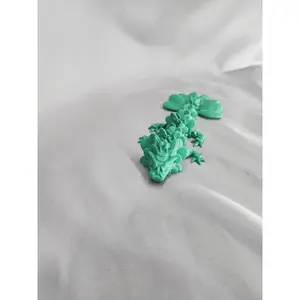 4 Leaf Clover Dragon Baby articulating figurine will surely bring some luck to your decor