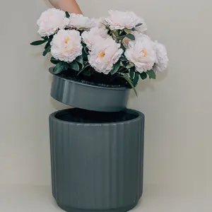 Bloomy Baby is a front porch–friendly diaper pail disguised as a flower pot, giving you a stylish and discreet way to store dirty diapers outdoors.