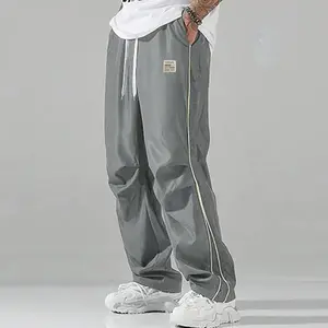 New for 2026 classic navy blue sweatpants with white side stripes and a lace-up waist, suitable for men’s casual wear