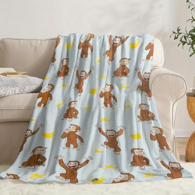 digital printed flannel Warm Throw Blanket with a Curious George monkey and banana pattern, suitable for sofas, beds, travel, camping, and office use. Made of warm, comfortable, and soft fabric, machine washable, for birthday and holiday gifts