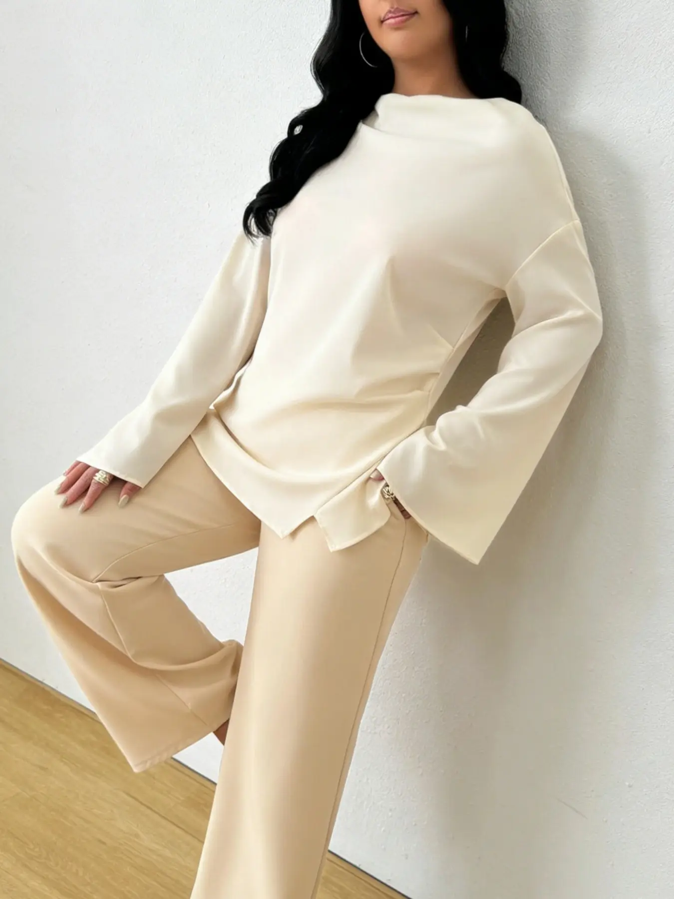 A women's minimalist high-end one neck Long sleeve flared sleeve shirt with irregular hem and waist cinching, exuding a slimming and gentle style. Suitable for spring and autumn, home, indoor, and outdoor wear