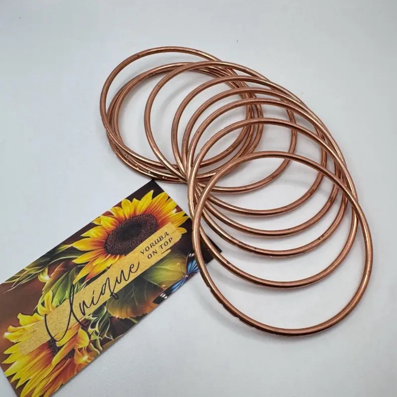 Oyá  Bangles . Set of 9 Oyá bangles. Stainless steel material. High quality . Real copper