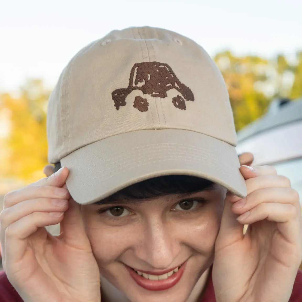 Embroidered Hat from "Dependency" - Beige Baseball Cap with Car Design from our Short Film Dependency