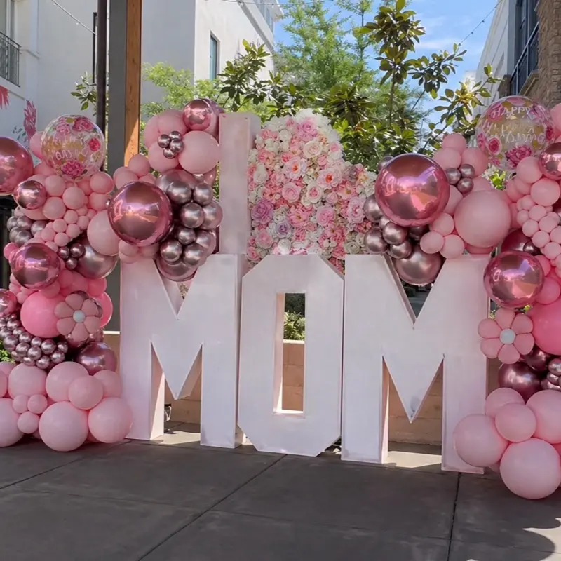 Mom Balloon Arch with Pink and Silver Balloons and Floral Decorations for a Special Occasion