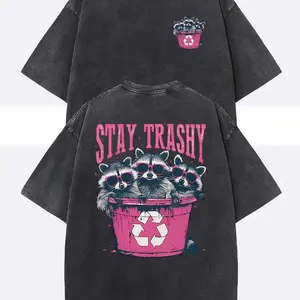 Unisex Stay Trashy Graphic Tee - Heavyweight Washed Black Tee with Pink Raccoon & Bin Design, Relaxed Fit Crew Neck for Summer Festivals, Beach Trips & Ironic Gifts | Eco-Conscious Humor