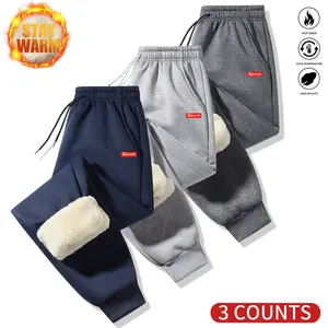 Men's three-piece warm winter sports suit with fleece lining and pattern design.The inner layer is made from thick fabric, providing warmth and comfort, suitable for outdoor activities and cold weather.