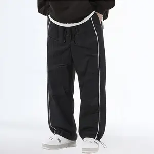 Men’s side-striped drawstring athletic pants — elastic waistband, adjustable cuffs; a perfect choice for street style and casual wear.