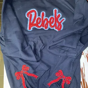 Gildan sweatshirt . Embroidery on front and both sides with bows Sweatshirt