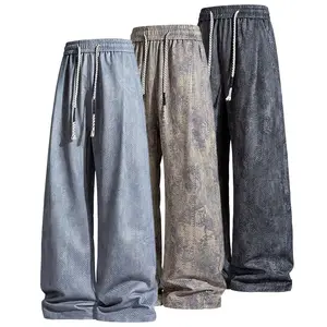 Japanese retro distressed textured casual pants—loose, relaxed wide-leg straight-cut joggers with a drawstring elastic waistband; comfortable, versatile, drapey athletic sweatpants suitable for teenage students.