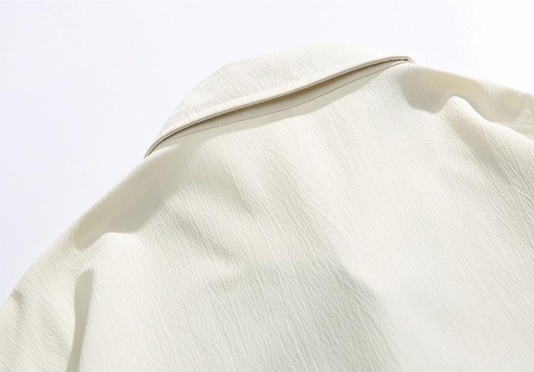 New Chinese-style long-sleeve top featuring bamboo leaf embroidery, a loose fit, frog buttons, design-forward retro high-end feel, and a drapey silhouette—a relaxed casual top with premium quality.