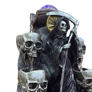 Santa muerte negra. Fuente de electricidad, 12 pulgadas de altura.