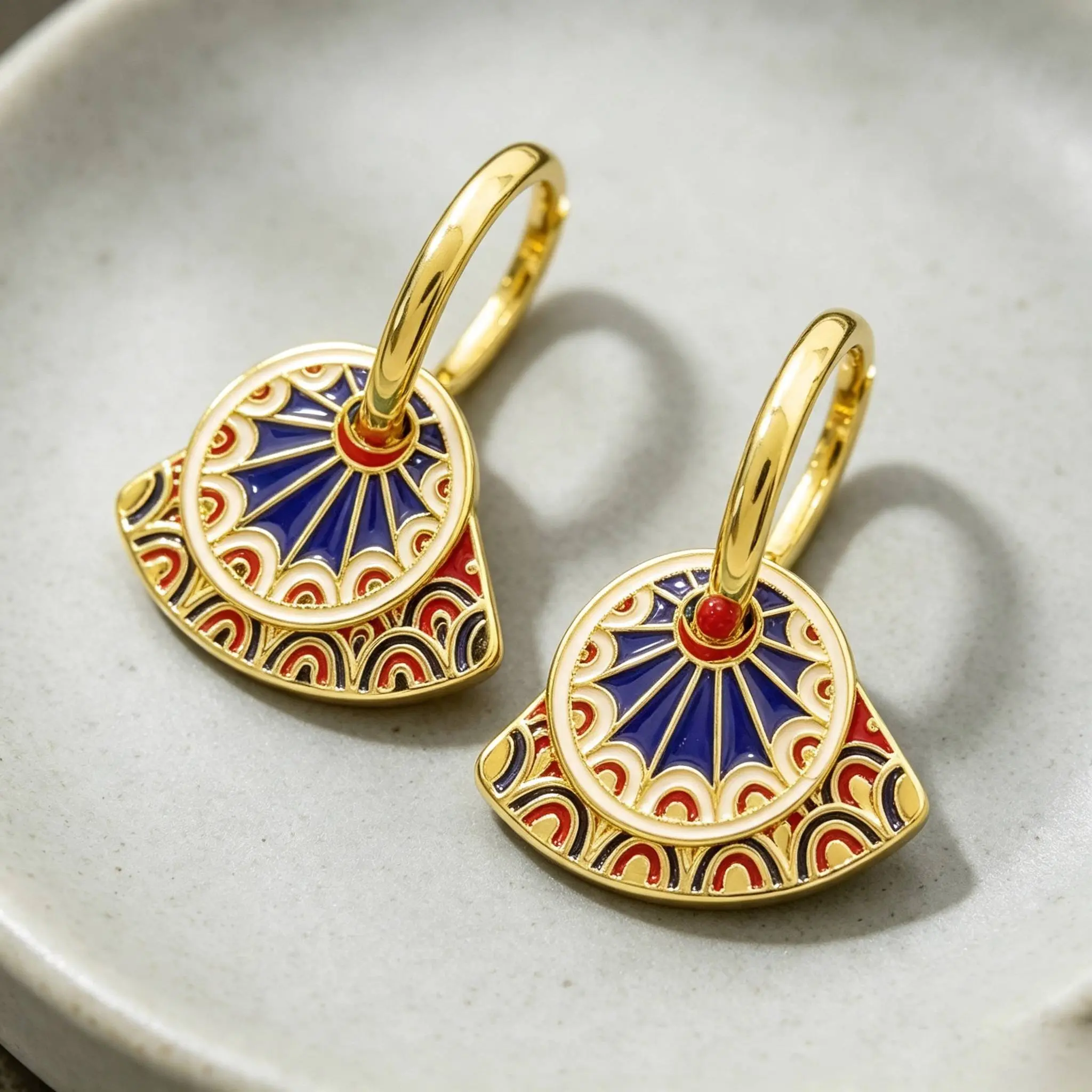 Chinese-inspired enamel fan-shaped earrings featuring a retro Dunhuang color-contrast ethnic design with painted details and gold leaf accents, in a modern Chinese style.