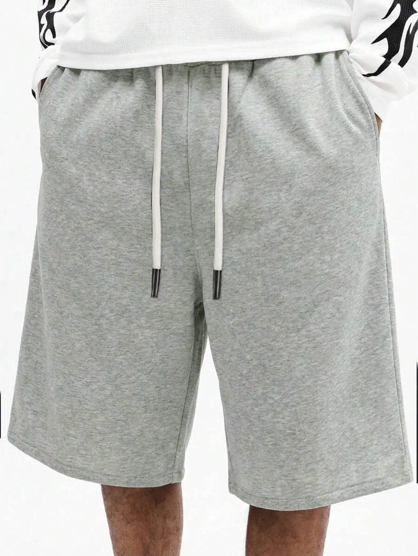Men’s solid-color knit athletic shorts with elastic drawstring waist, loose fit, knee-length casual shorts for gym and jogging, with side pockets