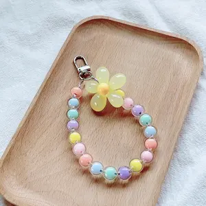 Japanese/Korean Instagram-style colorful handmade beaded flower keychains, wrist straps, and macaron-colored petal phone charms