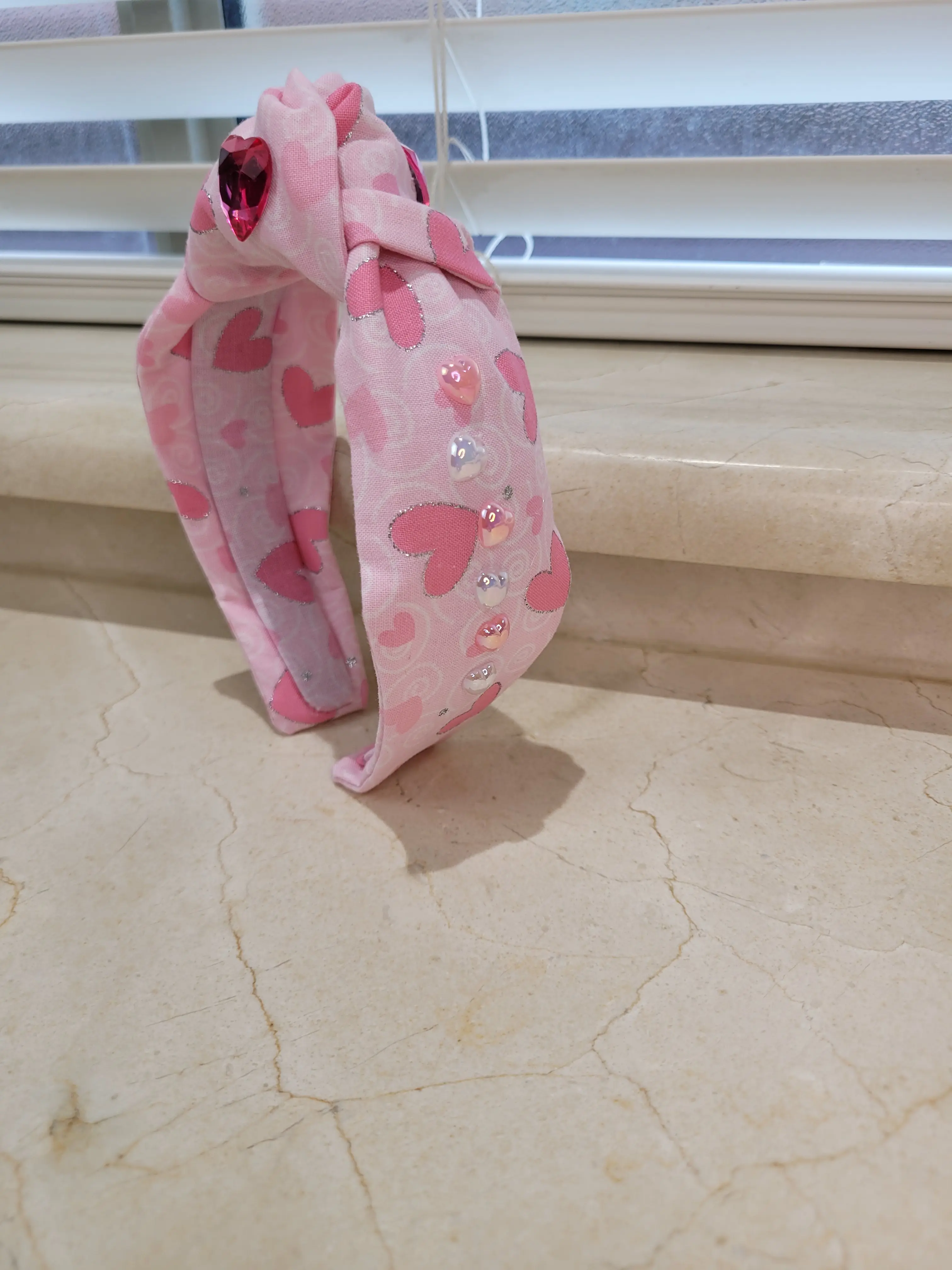 Pink heart shaped print top knot headband with heart shaped rhinestines