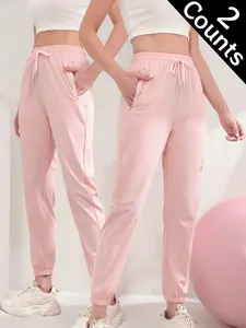 Women’s jogger sweatpants, high-waisted design, quick-dry fabric, lightweight and breathable, zippered pockets, elastic cuffs, casual athletic pants