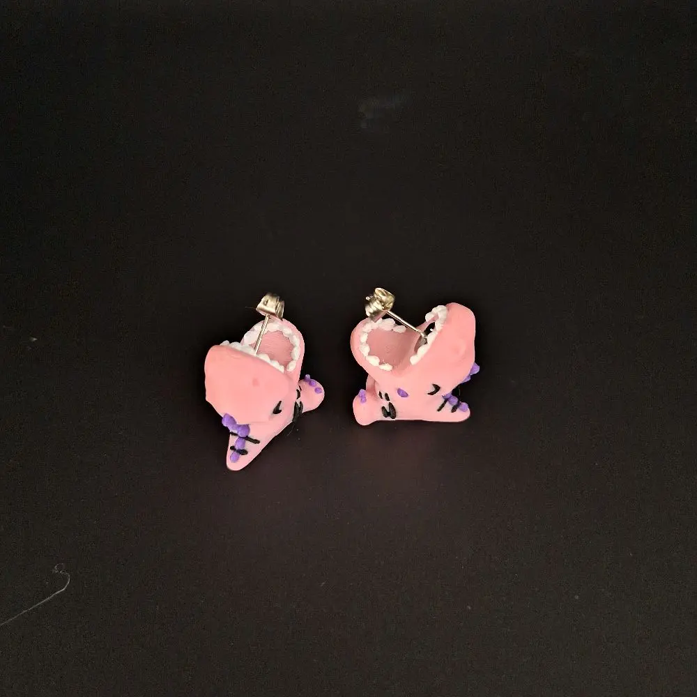 Pink Dino Bite earrings.