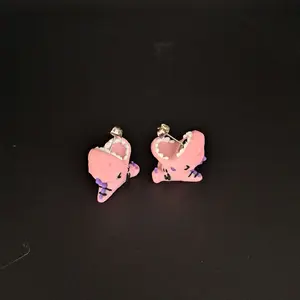 Pink Dino Bite earrings.