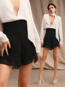 Elegant And Versatile Women's Black A-Line Shorts With Pleats And Lace Trim