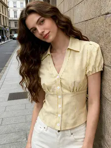 A women's fashionable yellow and white striped bubble sleeve short shirt adds sweetness, with a short silhouette that is proportionate and suitable for commuting to work, shopping, outdoor activities, indoor and outdoor dressing