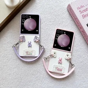 PU leather bear-shaped phone case with a silicone hand strap, featuring a hard PC back plate for phone protection. Compatible with Samsung Galaxy Z Flip7, Z Flip7FE, Z Flip6, and Z Flip5