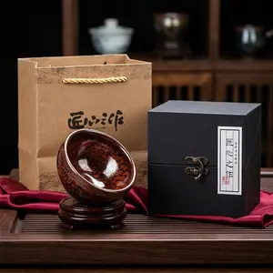 A Jian ware tea bowl (Jianzhan) crafted at an authentic, traditional Dragon Kiln. Each piece is a one-of-a-kind masterpiece, handmade by a skilled artisan. Fired using the traditional "Shibayaki" (wood-firing) method, this piece boasts collection-grade qu